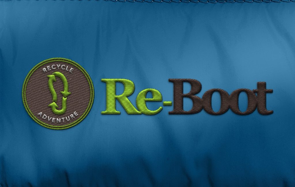 Re-Boot logo embroidered on a blue jacket